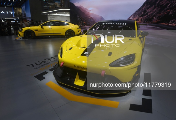 Visitors view a Xiaomi SU7 Ultra new energy vehicle at the 2024 Guangzhou Auto Show in Guangzhou, China, on November 15, 2024. 