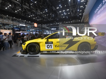 Visitors view a Xiaomi SU7 Ultra new energy vehicle at the 2024 Guangzhou Auto Show in Guangzhou, China, on November 15, 2024. (