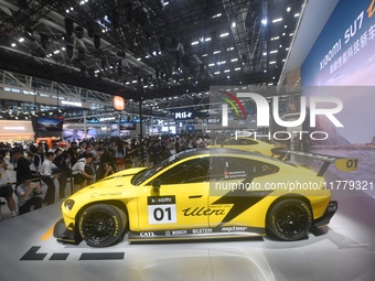 Visitors view a Xiaomi SU7 Ultra new energy vehicle at the 2024 Guangzhou Auto Show in Guangzhou, China, on November 15, 2024. (