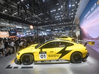 Visitors view a Xiaomi SU7 Ultra new energy vehicle at the 2024 Guangzhou Auto Show in Guangzhou, China, on November 15, 2024. (