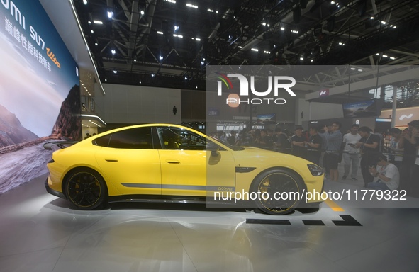 Visitors view a Xiaomi SU7 Ultra new energy vehicle at the 2024 Guangzhou Auto Show in Guangzhou, China, on November 15, 2024. 