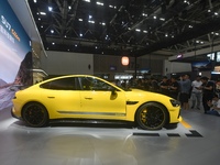 Visitors view a Xiaomi SU7 Ultra new energy vehicle at the 2024 Guangzhou Auto Show in Guangzhou, China, on November 15, 2024. (