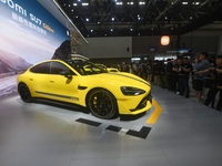 Visitors view a Xiaomi SU7 Ultra new energy vehicle at the 2024 Guangzhou Auto Show in Guangzhou, China, on November 15, 2024. (