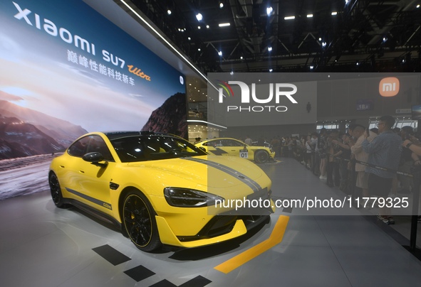 Visitors view a Xiaomi SU7 Ultra new energy vehicle at the 2024 Guangzhou Auto Show in Guangzhou, China, on November 15, 2024. 