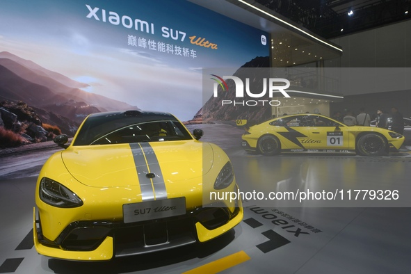 Visitors view a Xiaomi SU7 Ultra new energy vehicle at the 2024 Guangzhou Auto Show in Guangzhou, China, on November 15, 2024. 