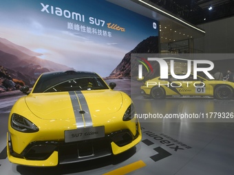 Visitors view a Xiaomi SU7 Ultra new energy vehicle at the 2024 Guangzhou Auto Show in Guangzhou, China, on November 15, 2024. (