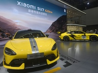 Visitors view a Xiaomi SU7 Ultra new energy vehicle at the 2024 Guangzhou Auto Show in Guangzhou, China, on November 15, 2024. (