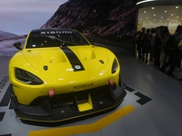 Visitors view a Xiaomi SU7 Ultra new energy vehicle at the 2024 Guangzhou Auto Show in Guangzhou, China, on November 15, 2024. (