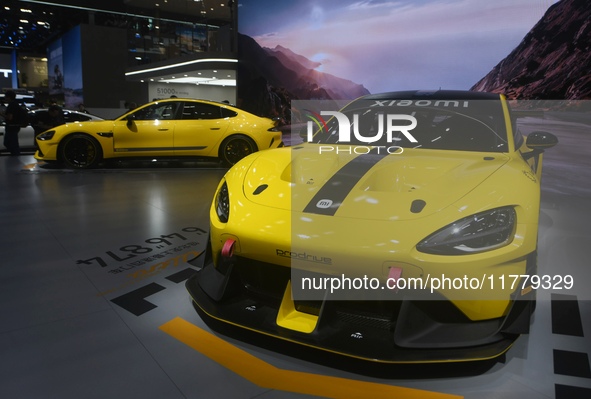 Visitors view a Xiaomi SU7 Ultra new energy vehicle at the 2024 Guangzhou Auto Show in Guangzhou, China, on November 15, 2024. 