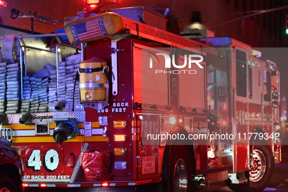 FDNY firefighters respond to a commercial high-rise fire on West 48th Street in Manhattan, New York, United States, on November 15, 2024. Th...