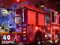 FDNY firefighters respond to a commercial high-rise fire on West 48th Street in Manhattan, New York, United States, on November 15, 2024. Th...