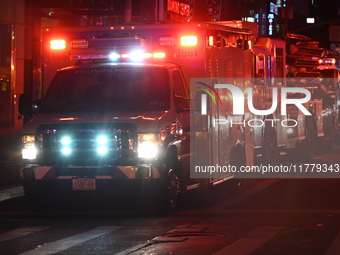 FDNY firefighters respond to a commercial high-rise fire on West 48th Street in Manhattan, New York, United States, on November 15, 2024. Th...