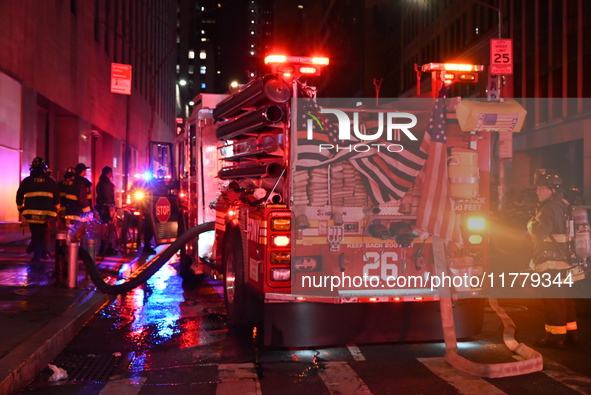 FDNY firefighters respond to a commercial high-rise fire on West 48th Street in Manhattan, New York, United States, on November 15, 2024. Th...