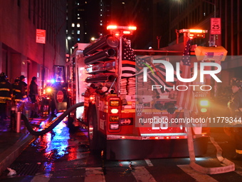 FDNY firefighters respond to a commercial high-rise fire on West 48th Street in Manhattan, New York, United States, on November 15, 2024. Th...