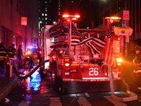 FDNY firefighters respond to a commercial high-rise fire on West 48th Street in Manhattan, New York, United States, on November 15, 2024. Th...