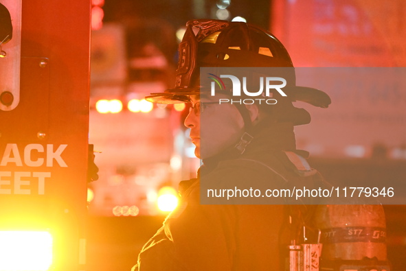 FDNY firefighters respond to a commercial high-rise fire on West 48th Street in Manhattan, New York, United States, on November 15, 2024. Th...