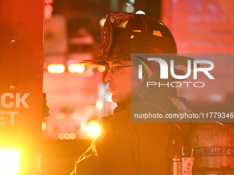 FDNY firefighters respond to a commercial high-rise fire on West 48th Street in Manhattan, New York, United States, on November 15, 2024. Th...