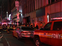 FDNY firefighters respond to a commercial high-rise fire on West 48th Street in Manhattan, New York, United States, on November 15, 2024. Th...