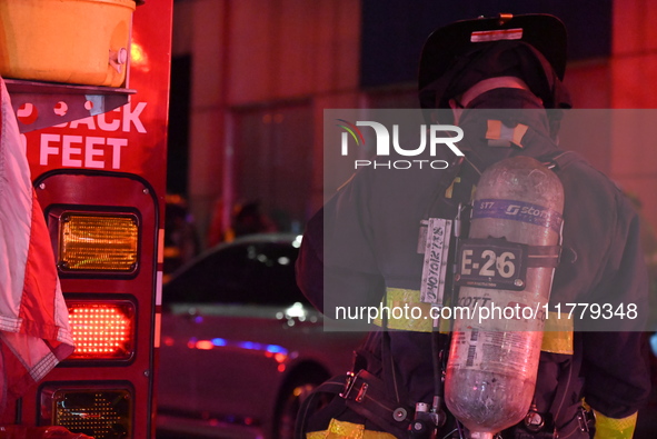 FDNY firefighters respond to a commercial high-rise fire on West 48th Street in Manhattan, New York, United States, on November 15, 2024. Th...