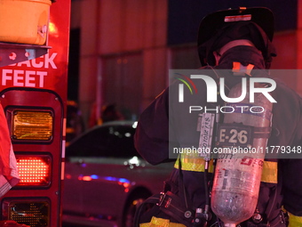 FDNY firefighters respond to a commercial high-rise fire on West 48th Street in Manhattan, New York, United States, on November 15, 2024. Th...