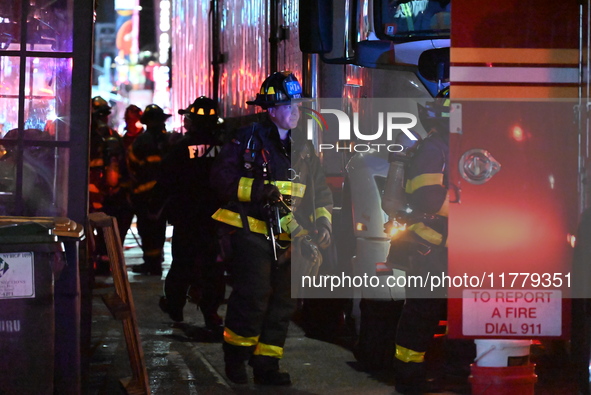 FDNY firefighters respond to a commercial high-rise fire on West 48th Street in Manhattan, New York, United States, on November 15, 2024. Th...