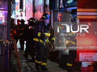 FDNY firefighters respond to a commercial high-rise fire on West 48th Street in Manhattan, New York, United States, on November 15, 2024. Th...