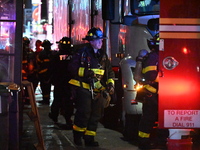 FDNY firefighters respond to a commercial high-rise fire on West 48th Street in Manhattan, New York, United States, on November 15, 2024. Th...