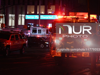 FDNY firefighters respond to a commercial high-rise fire on West 48th Street in Manhattan, New York, United States, on November 15, 2024. Th...