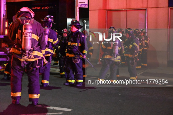 FDNY firefighters respond to a commercial high-rise fire on West 48th Street in Manhattan, New York, United States, on November 15, 2024. Th...