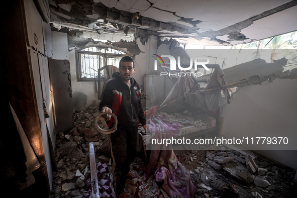 A Palestinian man inspects the site of an Israeli strike on a house in Deir Al-Balah in the central Gaza Strip on November 15, 2024. 