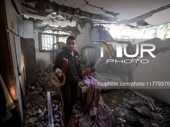 A Palestinian man inspects the site of an Israeli strike on a house in Deir Al-Balah in the central Gaza Strip on November 15, 2024. (