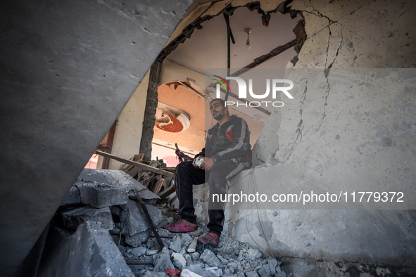 A Palestinian man inspects the site of an Israeli strike on a house in Deir Al-Balah in the central Gaza Strip on November 15, 2024. 