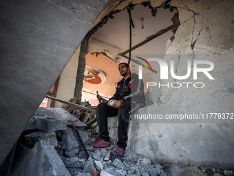 A Palestinian man inspects the site of an Israeli strike on a house in Deir Al-Balah in the central Gaza Strip on November 15, 2024. (