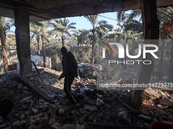 A Palestinian man inspects the site of an Israeli strike on a house in Deir Al-Balah in the central Gaza Strip on November 15, 2024. (