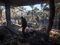 A Palestinian man inspects the site of an Israeli strike on a house in Deir Al-Balah in the central Gaza Strip on November 15, 2024. (