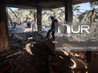 A Palestinian man inspects the site of an Israeli strike on a house in Deir Al-Balah in the central Gaza Strip on November 15, 2024. (