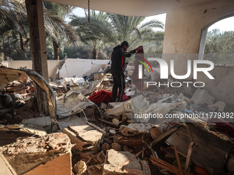 A Palestinian man inspects the site of an Israeli strike on a house in Deir Al-Balah in the central Gaza Strip on November 15, 2024. (