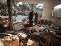 A Palestinian man inspects the site of an Israeli strike on a house in Deir Al-Balah in the central Gaza Strip on November 15, 2024. (