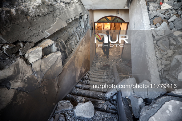 A Palestinian man inspects the site of an Israeli strike on a house in Deir Al-Balah in the central Gaza Strip on November 15, 2024. 