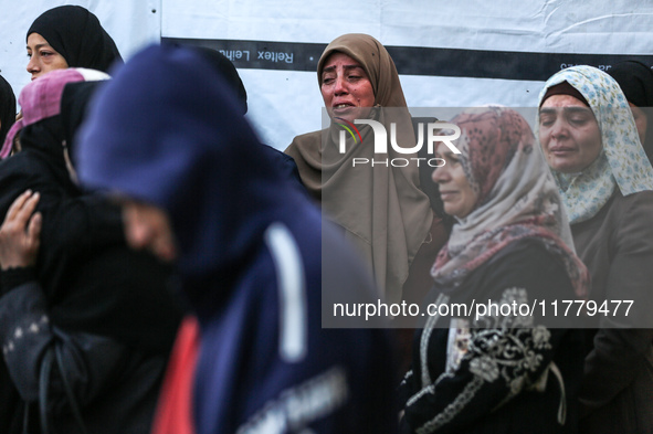 Relatives mourn during the funeral of Palestinians killed in an Israeli strike on tents of displaced people in Deir Al-Balah, Gaza Strip, on...