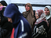 Relatives mourn during the funeral of Palestinians killed in an Israeli strike on tents of displaced people in Deir Al-Balah, Gaza Strip, on...