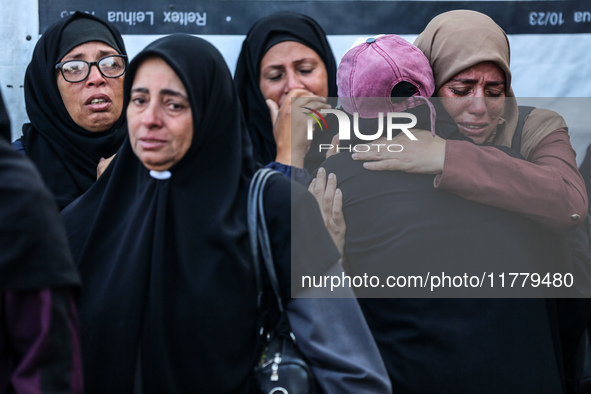 Relatives mourn during the funeral of Palestinians killed in an Israeli strike on tents of displaced people in Deir Al-Balah, Gaza Strip, on...