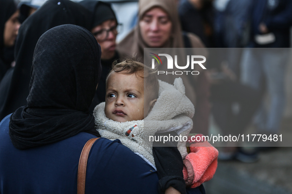 Relatives mourn during the funeral of Palestinians killed in an Israeli strike on tents of displaced people in Deir Al-Balah, Gaza Strip, on...