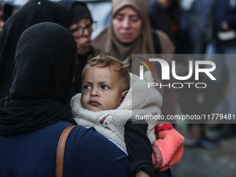 Relatives mourn during the funeral of Palestinians killed in an Israeli strike on tents of displaced people in Deir Al-Balah, Gaza Strip, on...