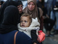 Relatives mourn during the funeral of Palestinians killed in an Israeli strike on tents of displaced people in Deir Al-Balah, Gaza Strip, on...