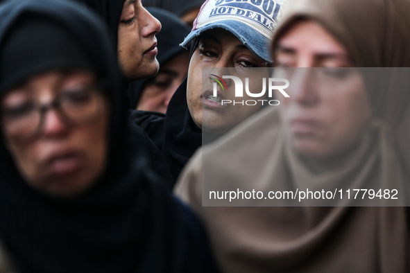 Relatives mourn during the funeral of Palestinians killed in an Israeli strike on tents of displaced people in Deir Al-Balah, Gaza Strip, on...