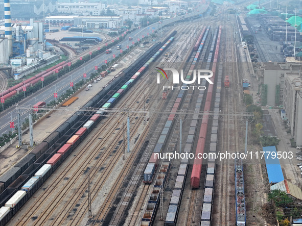 A China-Europe freight train loaded with containers waits to depart at the Lianyungang Port Railway marshalling station in Lianyungang, East...