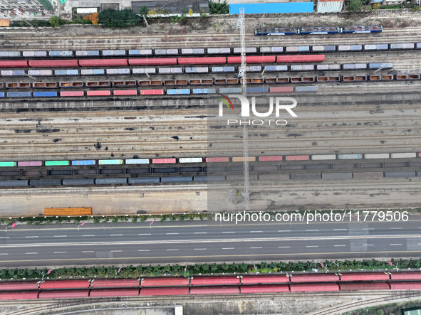 A China-Europe freight train loaded with containers waits to depart at the Lianyungang Port Railway marshalling station in Lianyungang, East...