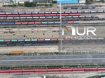 A China-Europe freight train loaded with containers waits to depart at the Lianyungang Port Railway marshalling station in Lianyungang, East...