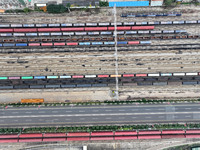 A China-Europe freight train loaded with containers waits to depart at the Lianyungang Port Railway marshalling station in Lianyungang, East...